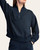 Woman modeling the front of the teal and navy Kennedy Quarter Zip Scuba Pullover
