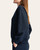 Side profile showing the relaxed fit of the women's scuba quarter zip pullover