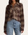 Model wearing the Kasey Plaid Button Up in chocolate and tan tucked into denim jeans.