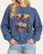 Front view of the Washed Denim Blue Vintage Cowboy Graphic Sweatshirt featuring a cowboy and dice graphic