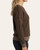 Side profile of a women's dark chocolate thermal pullover showing raw edge seams along the drop shoulders and a slightly tapered waist.