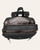 Open top view of the Alora Convertible Backpack - Black, showing two main compartments, printed lining and an interior zip pocket.