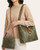 Model wearing the olive Liz Soto Alexa Hobo with its removable crossbody bag