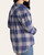 Back view of the Thread & Supply Daphne Shirt displaying the blue, ivory, and rust plaid pattern and curved hemline.