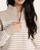 Close-up of the quarter zip mock neck on the Thread & Supply Russell Sweater in beige ivory.