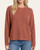 Model wearing the Carmine Crewneck Sweater - Rust, front view with a crew neckline, textured fabric and long sleeves.