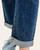 Close-up of the rolled cuff on Judy Blue Boyfriend Jeans - Indigo, showing the lighter denim reverse and contrast stitching.