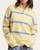 Front view of the Maria Mock Neck Sweater - Lemon/Sky on a model, showing the half zip, blue and brown stripes and ribbed cuffs.