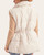 Back view of the Funnel Neck Puffer Vest - Ecru on a model, showing horizontal quilting, a high collar and cinched waist.