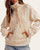 Front view of the Crochet Detail Quarter Zip Pullover - Oatmeal, showing the openwork front panel, drawcords and covered zipper placket.