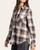 Angled front view of the Thread & Supply Lewis Shirt - Cream Brown Plaid, worn untucked to show the curved hem and button cuffs.