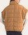 Back view of Sierra Cinch Waist Vest - Camel, showing cap sleeves, a stand collar, grid quilting and hem toggles.