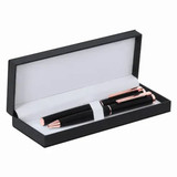 A pen set in a black box featuring two metallic pens with rose gold accents.