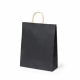 A black recycled paper bag with a gold handle and a simple design. It features a logo on one side.