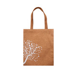 A cork tote bag in a natural brown colour featuring a white tree design and tan handles.