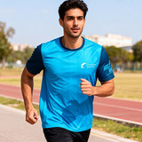 A blue and navy 100% polyester sublimated tee shirt with a logo, modelled by a man jogging outdoors.