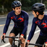 Men’s long sleeve cycling jerseys in navy with red and blue splatter design, featuring a logo, worn by two cyclists.