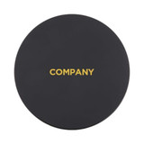A black wireless charger with a round shape and a gold logo in the centre.