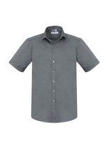 A grey short sleeve button-up shirt with a pocket and a logo on the label.