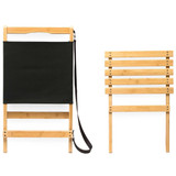 A black fabric beach chair with a bamboo frame, featuring a strap for carrying. The chair is shown in both upright and folded positions.