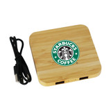 A bamboo wireless charging dock in a square shape, featuring a logo and a connected black charging cable.