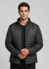 A puffer jacket in black, featuring a zip-up front and a modern, fitted design, with a logo on the chest.