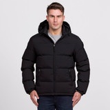 A black puffer jacket with a hood, featuring a zip front and side pockets, worn by a standing model. A black puffer jacket with a hood, featuring a zip front and side pockets, worn by a standing model.