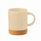 A ceramic mug in a cream colour with a cork base and a handle. It features a logo on the side.