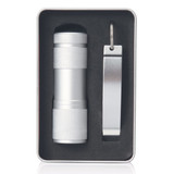 A drink bottle opener and LED torch in a silver finish, presented in a sleek black and silver container with a logo.