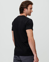 A black men's premium cotton tee displayed from the back, featuring a fitted design. It has a logo. A black men's premium cotton tee displayed from the back, featuring a fitted design. It has a logo.