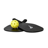 A pickleball set featuring two black paddles and a yellow perforated ball, with a logo on one paddle.
