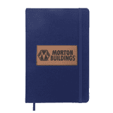 A navy blue A5 notebook with a textured cover and an embossed logo patch. It includes an elastic band closure.