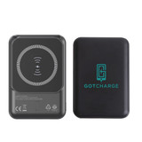 A black 5000mAh eco magnetic power bank with a wireless charging pad and a logo on one side.