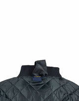 A dark green soft shell jacket with a quilted design and a ribbed collar, featuring a hanging loop at the back.