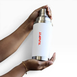 A drink bottle in silver and white, featuring a logo, held between two hands.