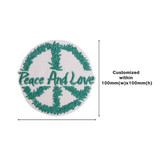A circular woven patch featuring a peace sign surrounded by green foliage and the text "Peace And Love" in green. A circular woven patch featuring a peace sign surrounded by green foliage and the text "Peace And Love" in green.