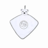 A white baby blanket with a teddy bear head and a grey trim, featuring a logo on the front. A white baby blanket with a teddy bear head and a grey trim, featuring a logo on the front.