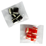 Assorted humbugs in black and white, and red and white, packaged in clear bags. Each bag contains multiple pieces.