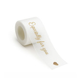 A roll of white organza ribbon with a gold printed message, featuring a small heart design.