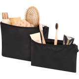 A set of two black toiletry bags filled with various grooming products, including a hairbrush, lotion, and toothbrushes.
