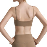 A women's seamless thin-strap U-back yoga crop bra tank in a light brown shade, featuring a smooth design and branding.
