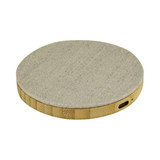 A round, beige wireless charger with a textured surface and a side port. It features a simple, modern design.