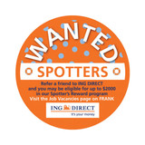 An orange circular promotional sticker with white text and a logo, featuring polka dots and a "Wanted" theme.