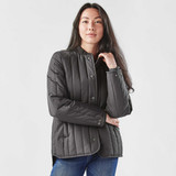 A women's thermal jacket in dark grey, featuring a button-up front and quilted design, with a logo on the sleeve.