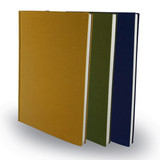 Three B5 Santiago Notebooks in mustard yellow, olive green, and navy blue, featuring a plain fabric cover and white pages.