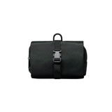 A black folding travel toiletry bag featuring a buckle closure and a hanging loop. It has a textured surface and a zippered compartment.