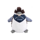 A Kookaburra plush toy in brown, white, and grey, wearing a blue bandana with festive text.