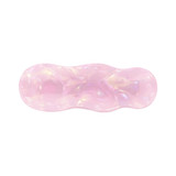 A pink iridescent alligator hair clip with a wavy design and a glossy finish. Contains branding.