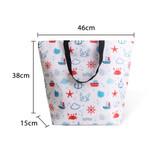 A large cooler tote bag in white, featuring a nautical print with red and blue designs, including boats and sea creatures.