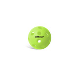 A bright green pickleball with holes and a logo on its surface.